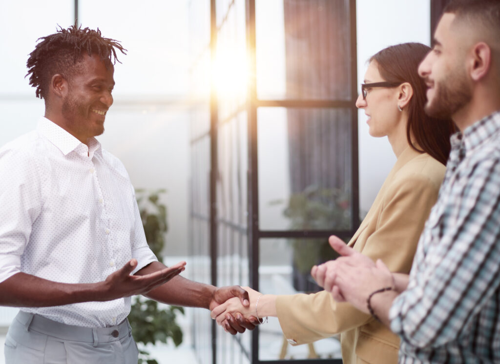 Confident Business Partners Meet In An Office Building And Talk